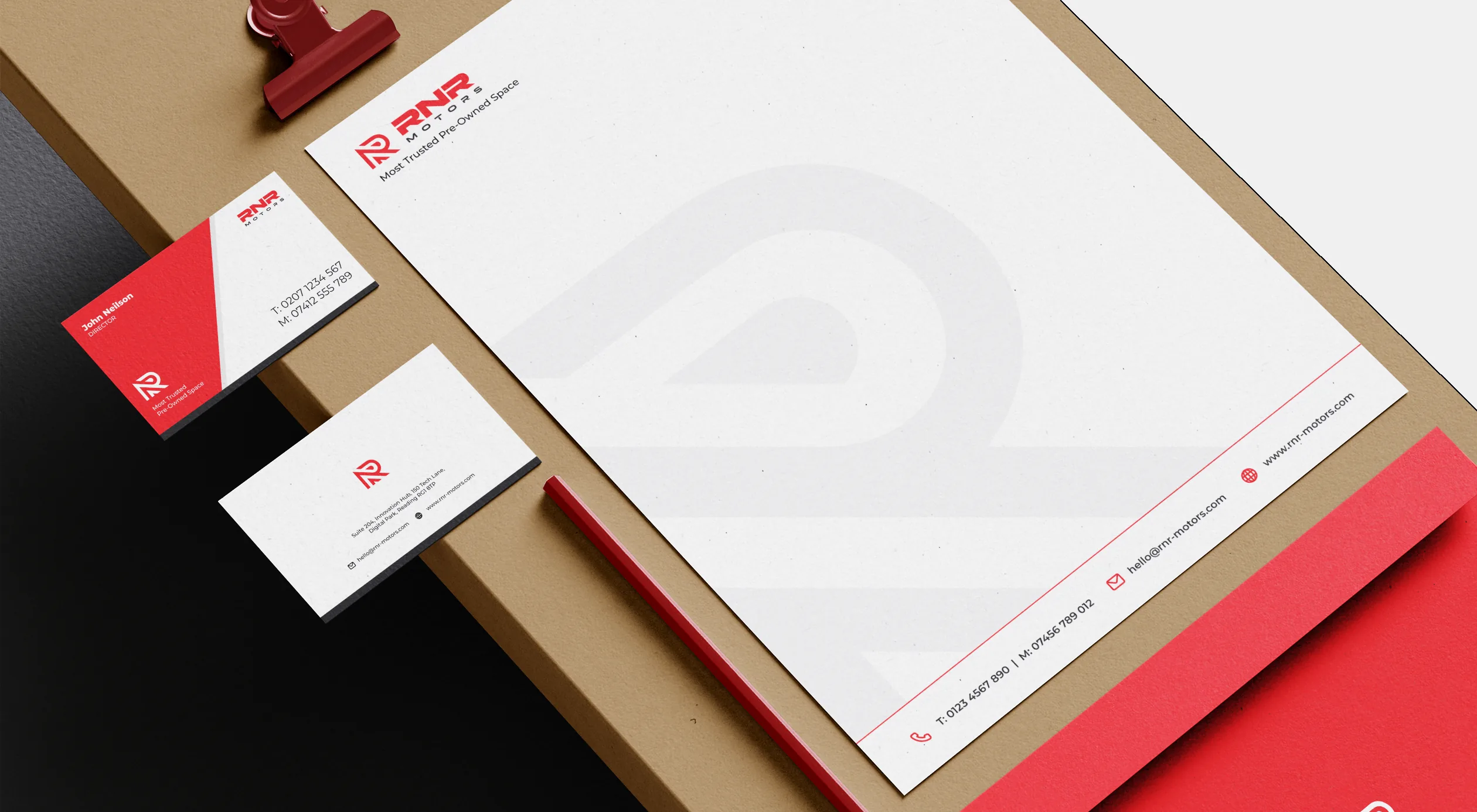 RNR Motors stationery: letterhead, business cards, pencil and envelope on kraft board